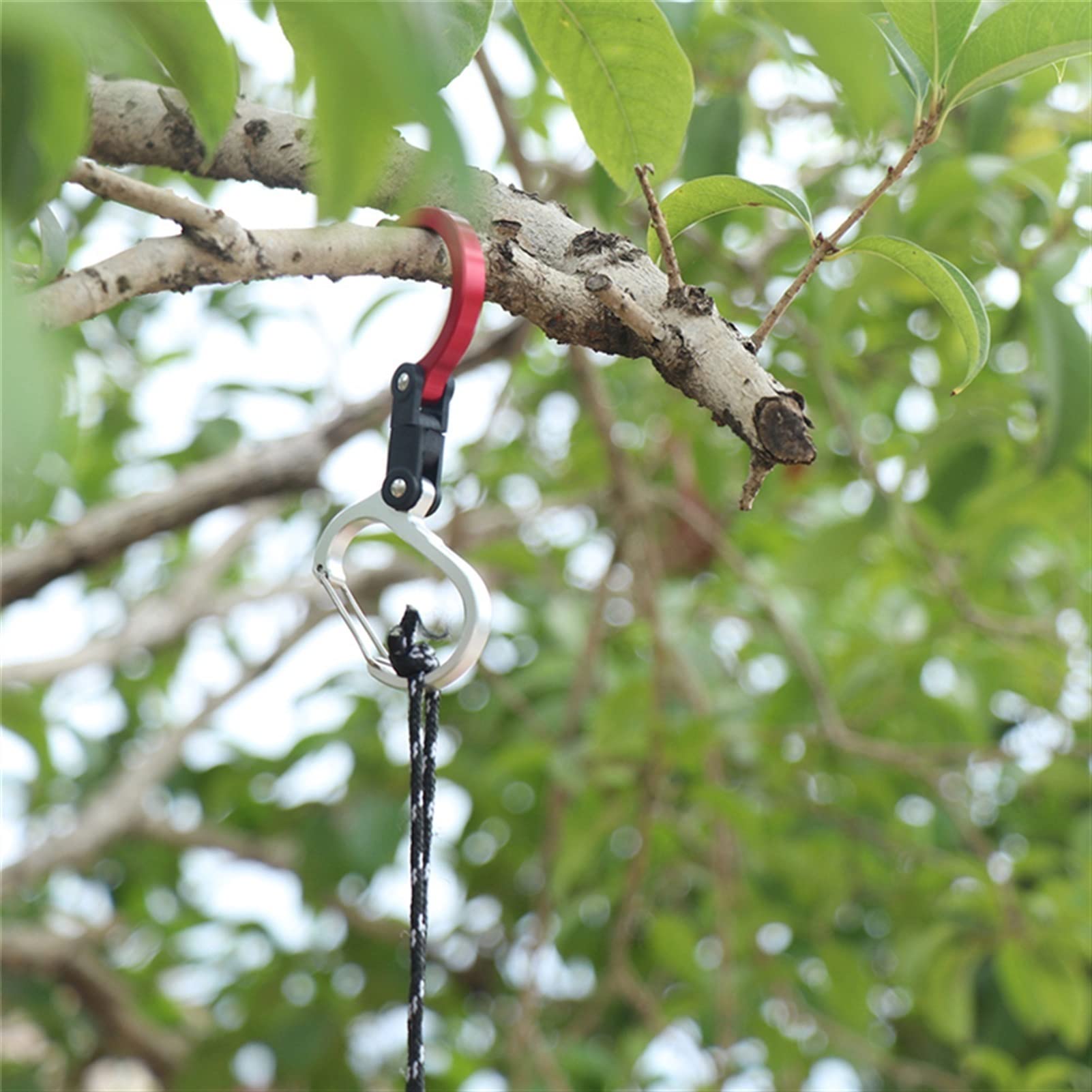 LWBXTTG travel accessory clip in red visible on a travel bag.