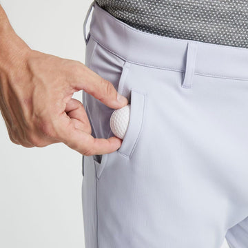 M MAELREG golf pants showing water-resistant finish for outdoor adventures.