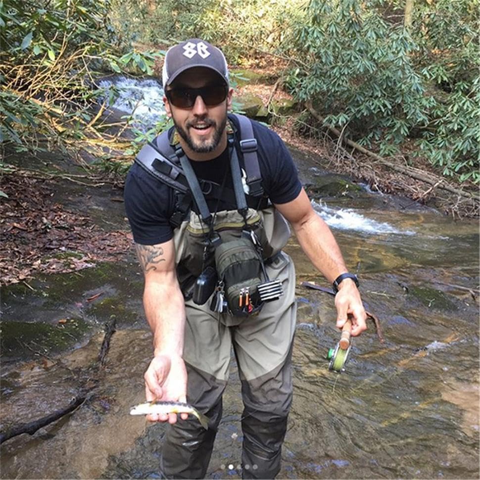 Angler wearing the M MAXIMUMCATCH chest bag in waders
