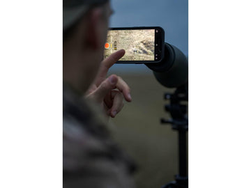MAGVIEW made-in-USA black adapter shown with phone plate for versatile field use.