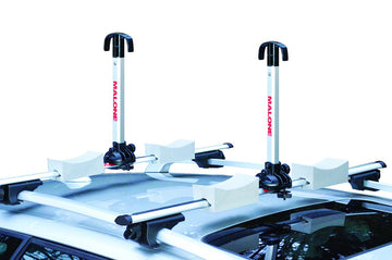 Malone Stax Pro2 folding posts attach to cross bars for quick, tool-free kayak transport.