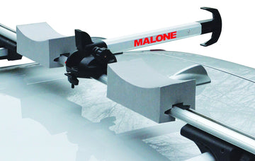 Malone Stax Pro2 secures two kayaks with sturdy straps for stable travel.