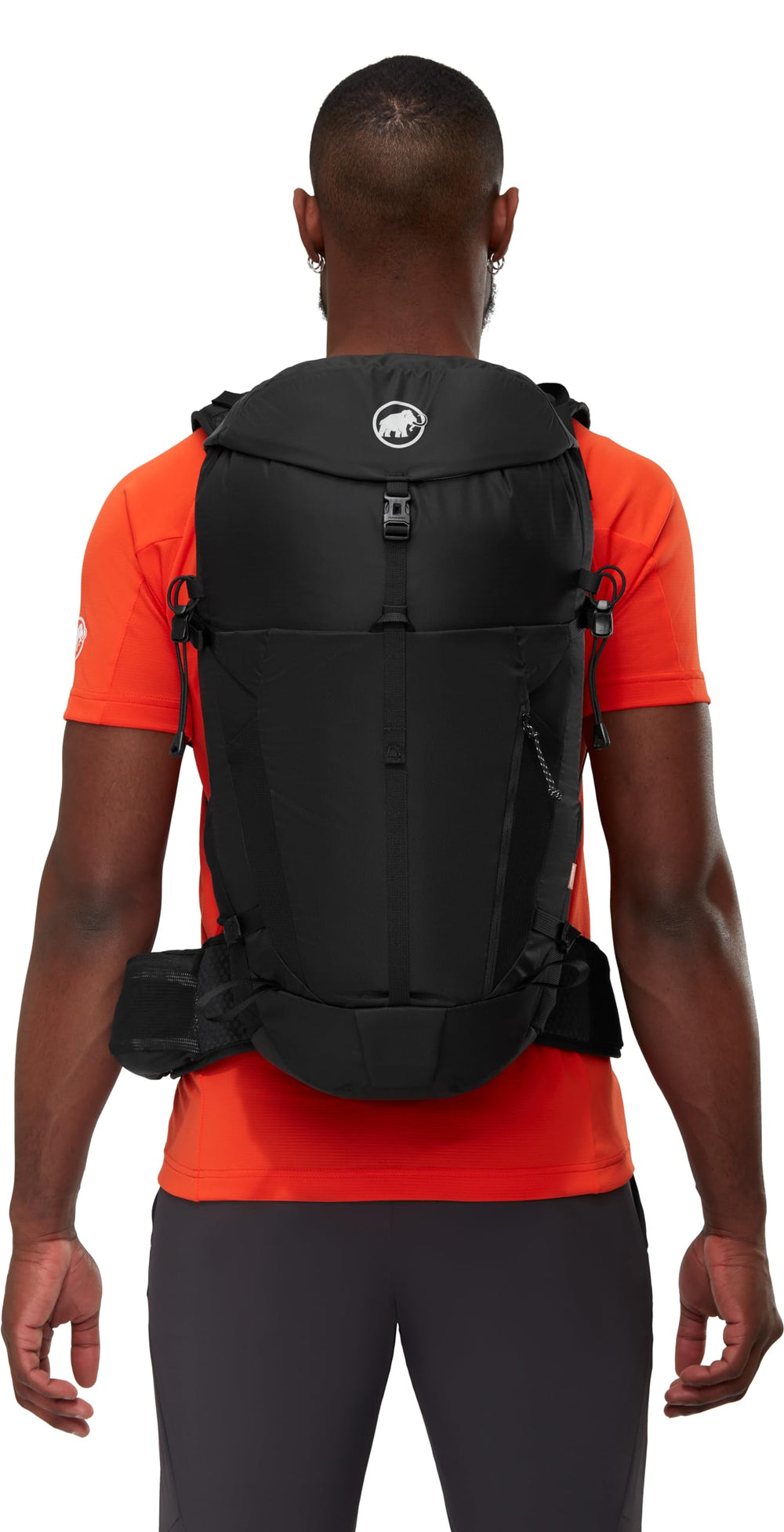Mammut Lithium 30 integrated rain cover protects contents during sudden showers.