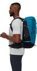 Mammut Lithium 30 detachable rain cover stored in pack for weather protection.