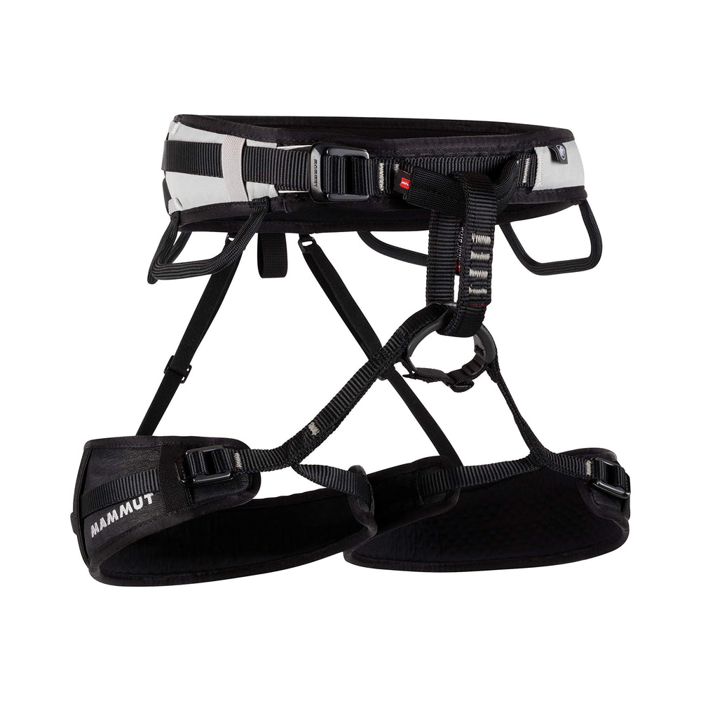Mammut Ophir 3 Slide harness shown on a rock wall for versatile climbing.