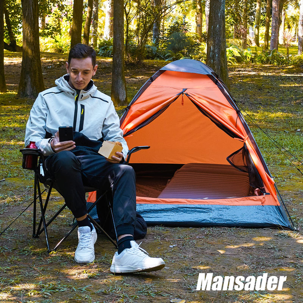 Mansader tent with rain fly, stakes, and ropes ready for outdoor trips