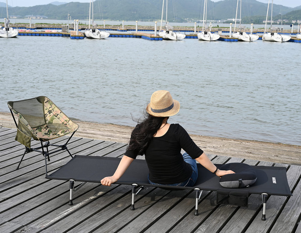 Marchway camping cot full-length setup shows stable frame for all-night comfort.