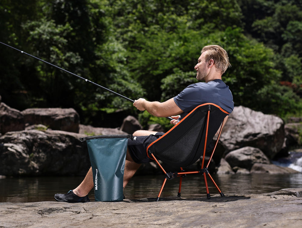MARCHWAY chair strapped to backpack during a hiking trip.