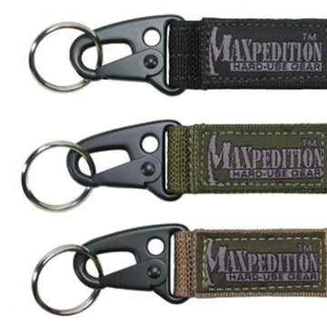 Maxpedition Keyper closeup in black showing compact retention and quick belt access