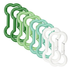 MECCANIXITY bone-shape clip cream white secures keys on a backpack