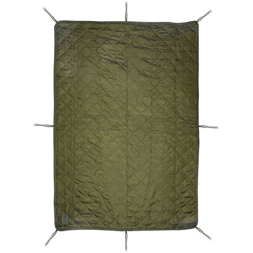 Medals of America woobie poncho liner in camping setup — doubles as shelter alternative.