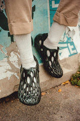 Merrell cushioned heel and toe for durable support in gray socks.