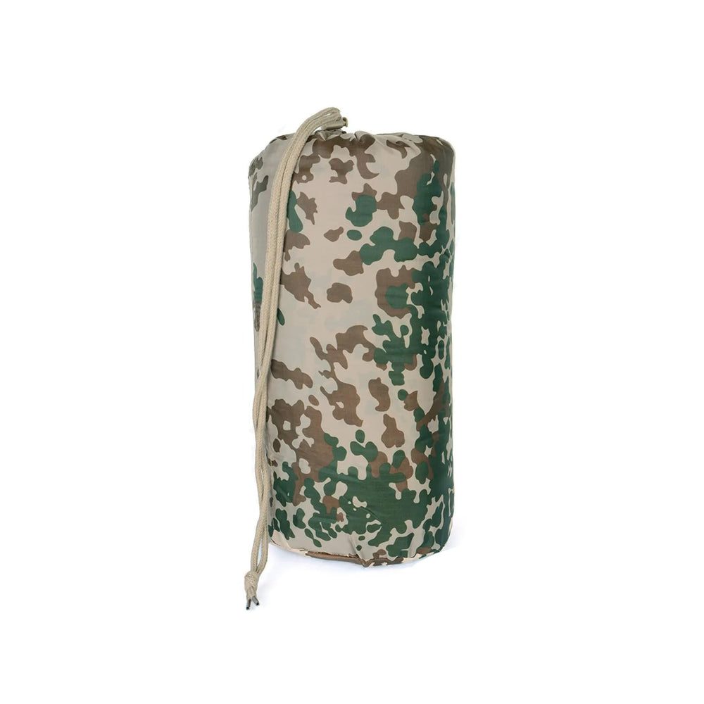 Mil-Tec Ripstop Poncho Liner functioning as a ground mat to stay dry.