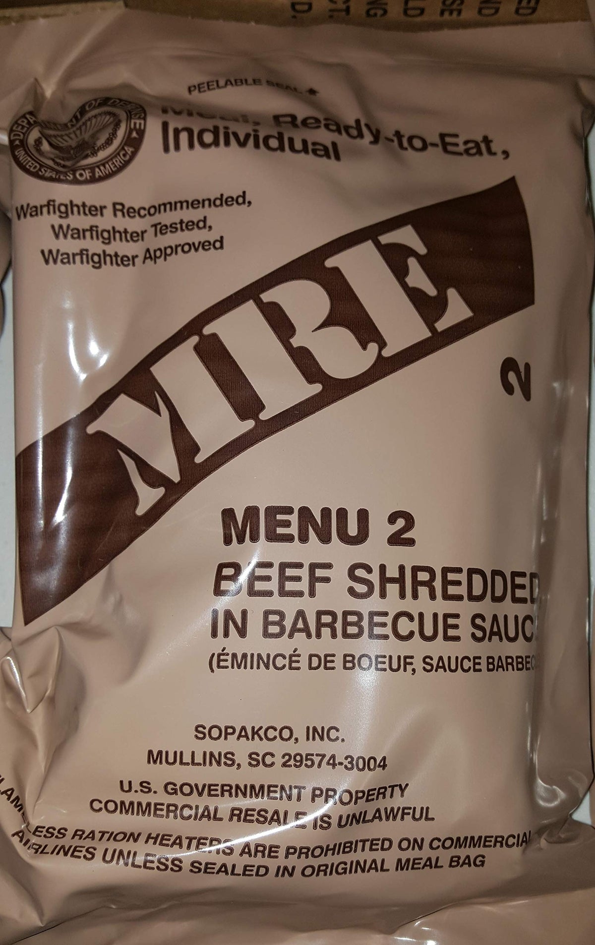 Military MRE beef BBQ package, ready-to-eat, ideal for camping and emergencies.