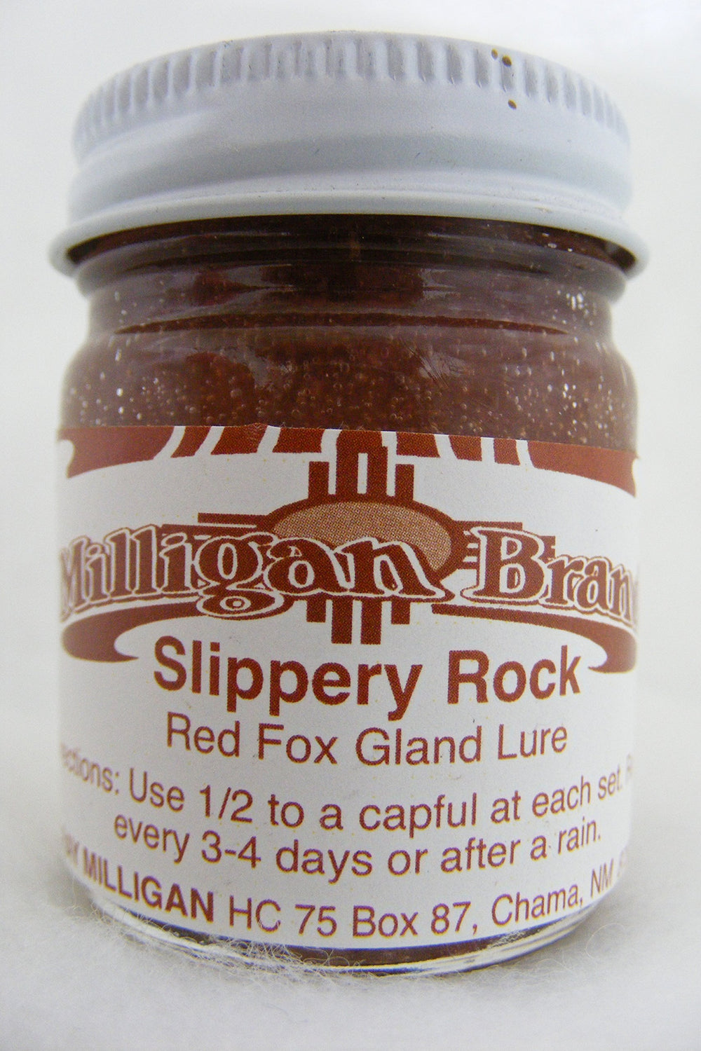 Milligan's Slippery Rock Red Fox Gland Lure at urine post demonstrating usage in fox sets.