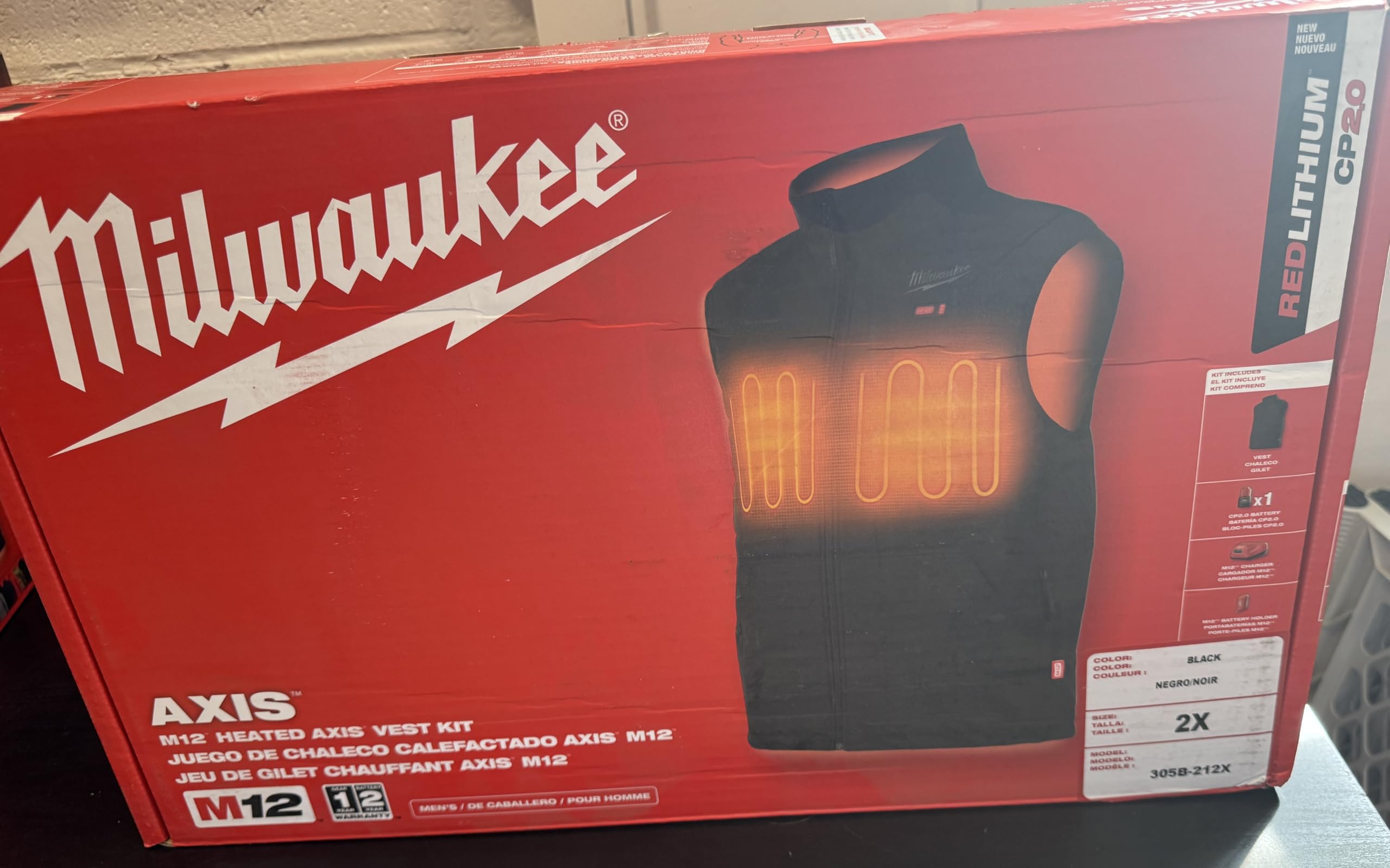 Milwaukee M12 Heated AXIS Vest with chest and back heat zones for warmth.