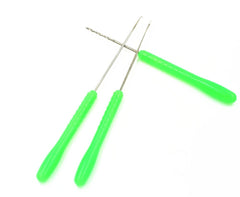 Close-up of rigging needles, swinger, and drill needle components