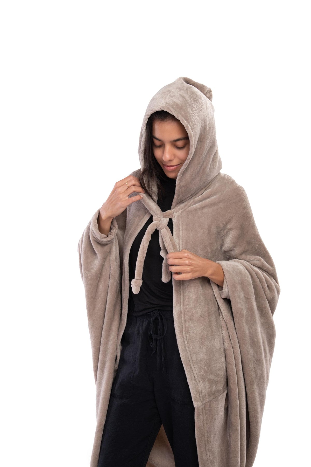 Mintra Home Wearable Blanket Hoodie in Mocha showcased on a couch for instant warmth.