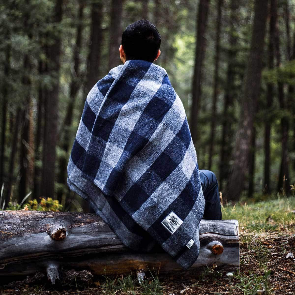 Minus33 Camp Throw Blanket folds compactly for easy packing on trips.