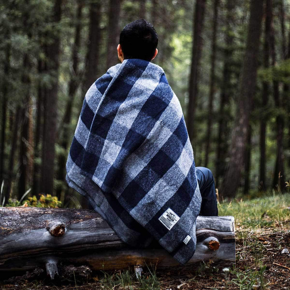 Minus33 Camp Throw Blanket folds compactly for easy packing on trips.