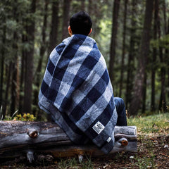 Minus33 Camp Throw Blanket folds compactly for easy packing on trips.