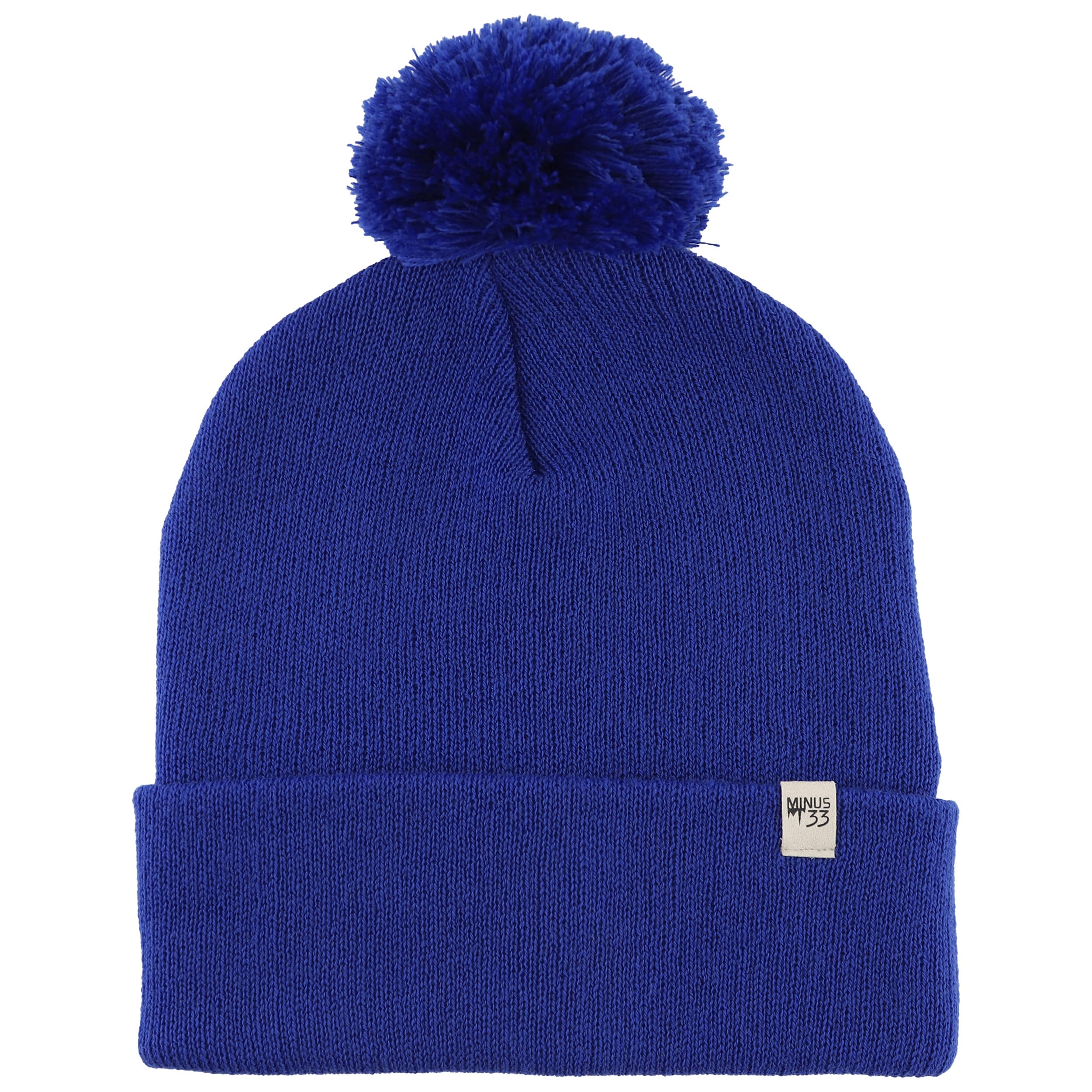 Minus33 Merino midweight pom beanie in royal blue viewed from the front, cozy warmth.