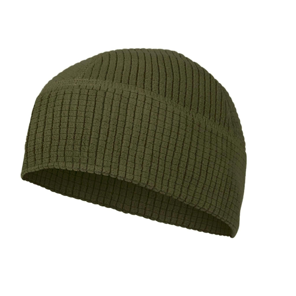 M McGuire Gear grid fleece cap on head providing lightweight warmth for outdoor adventures.