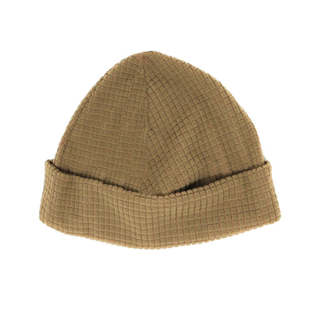 Rolled and packable grid fleece cap ready for easy carry on outdoor adventures