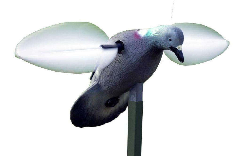 MOJO Outdoors pigeon spinning wing decoy in a field attracts pigeons from distance