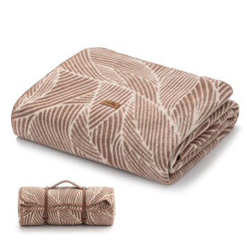 Molithe wool blanket folded, 62x86, showcasing versatile indoor and outdoor warmth