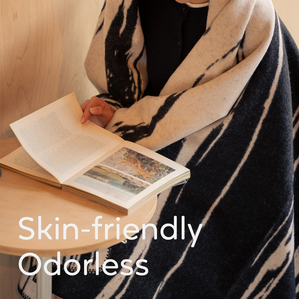 Molithe wool blanket folded for cozy indoor lounging