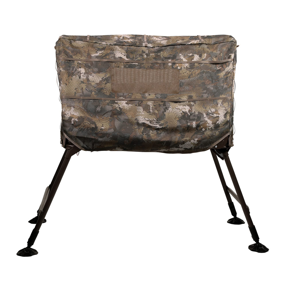 Momarsh Invisi Lab blind side view shows adjustable legs on rugged terrain.