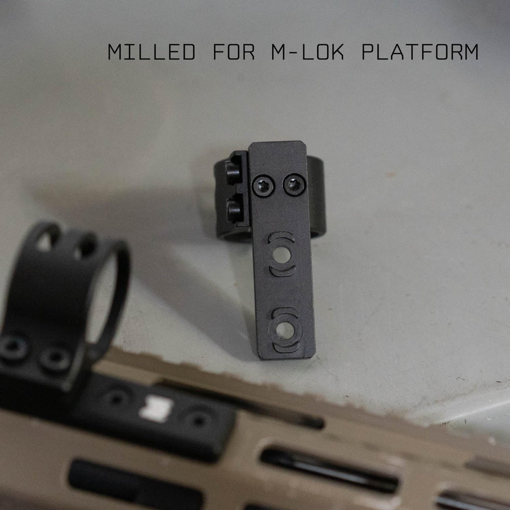 Monstrum flashlight ring mounted on rifle setup for versatile illumination