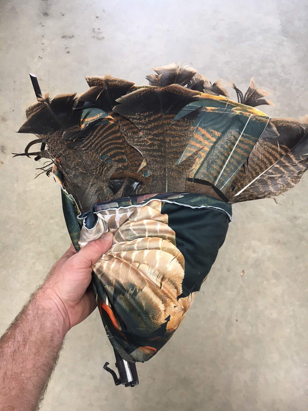 Tri-fold panels protect real feathers during transport in vest, backpack, or slip sack.