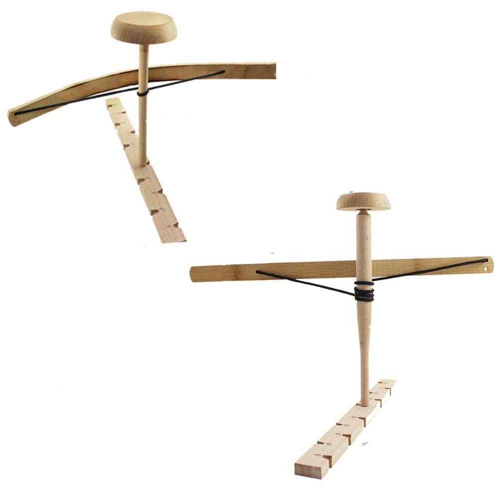 MOOKEENONE fire-bow set used for primitive fire-starting practice outdoors.