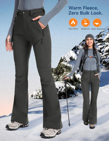 Moosehill womens snow pants ankle-zip closeup showing expandable cuffs over boots.