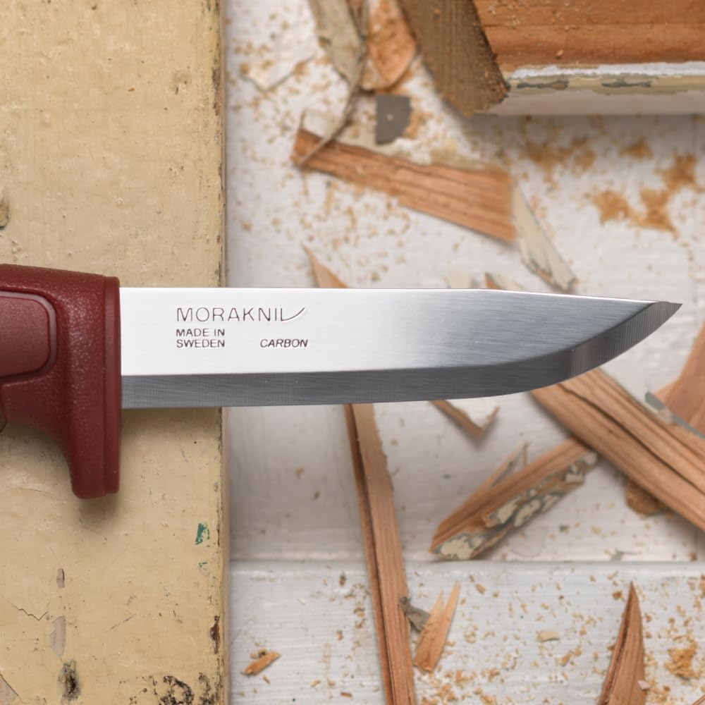 Morakniv Basic 511 in hand demonstrating tool readiness.