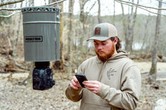 Graphic showing Moultrie Connect Bluetooth app control for the feeder.
