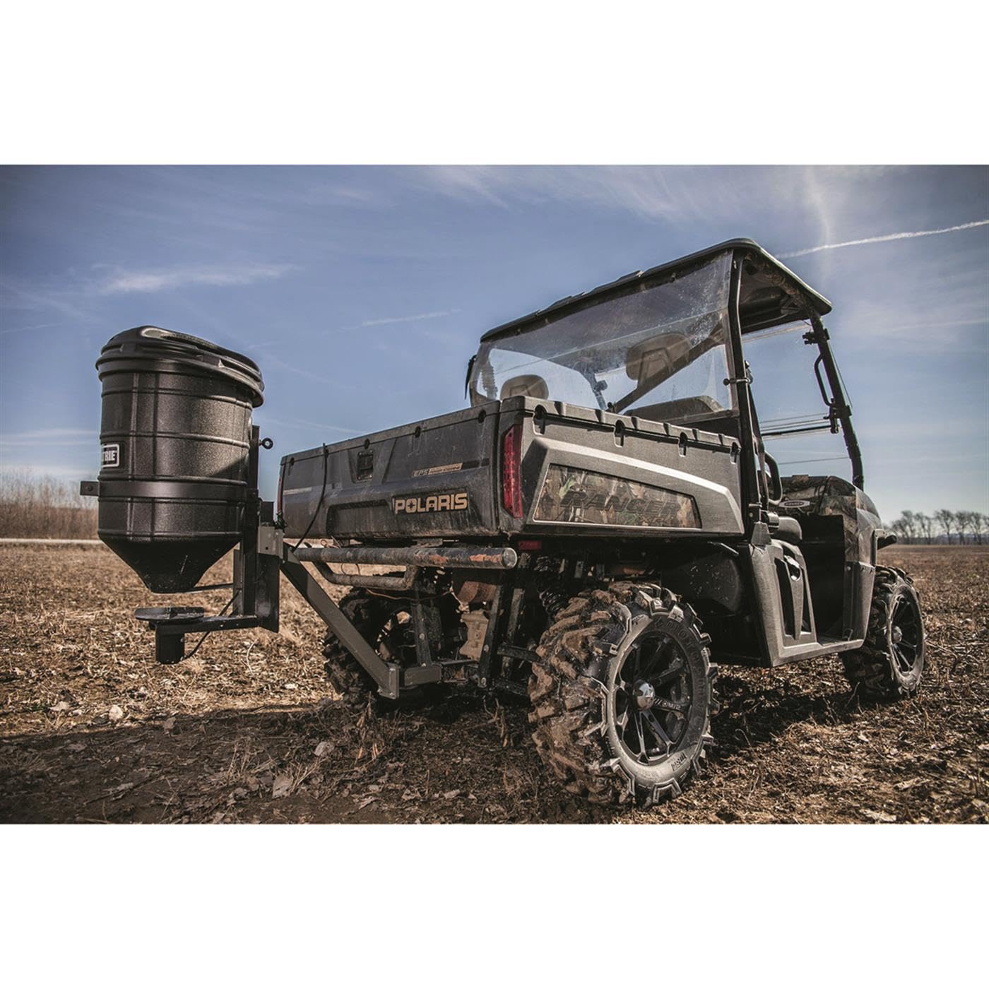 Handheld controller for seed and fertilizer dispense settings on the ATV spreader