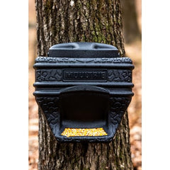 Close-up of mounting strap securing feed bin to a tree