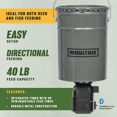 Metal hopper fish feeder for pond or water-edge setups.