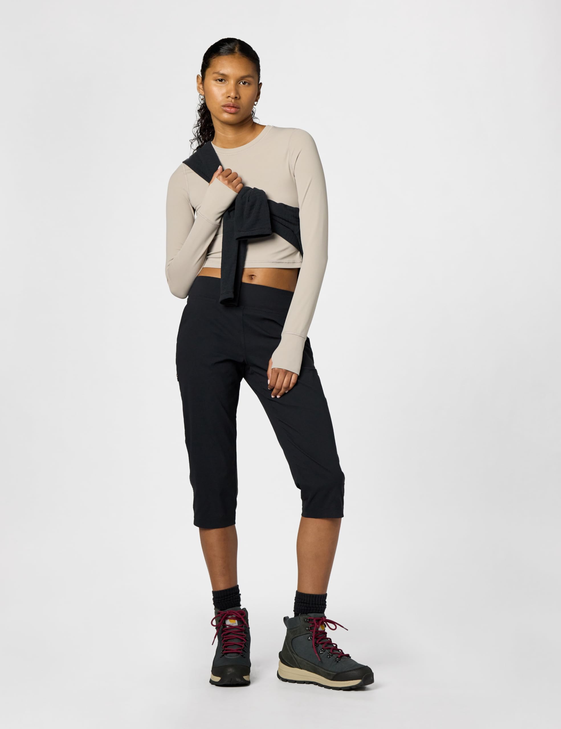Mountain Hardwear Dynama Capri pocket closeup emphasizes secure right-thigh zip pocket.