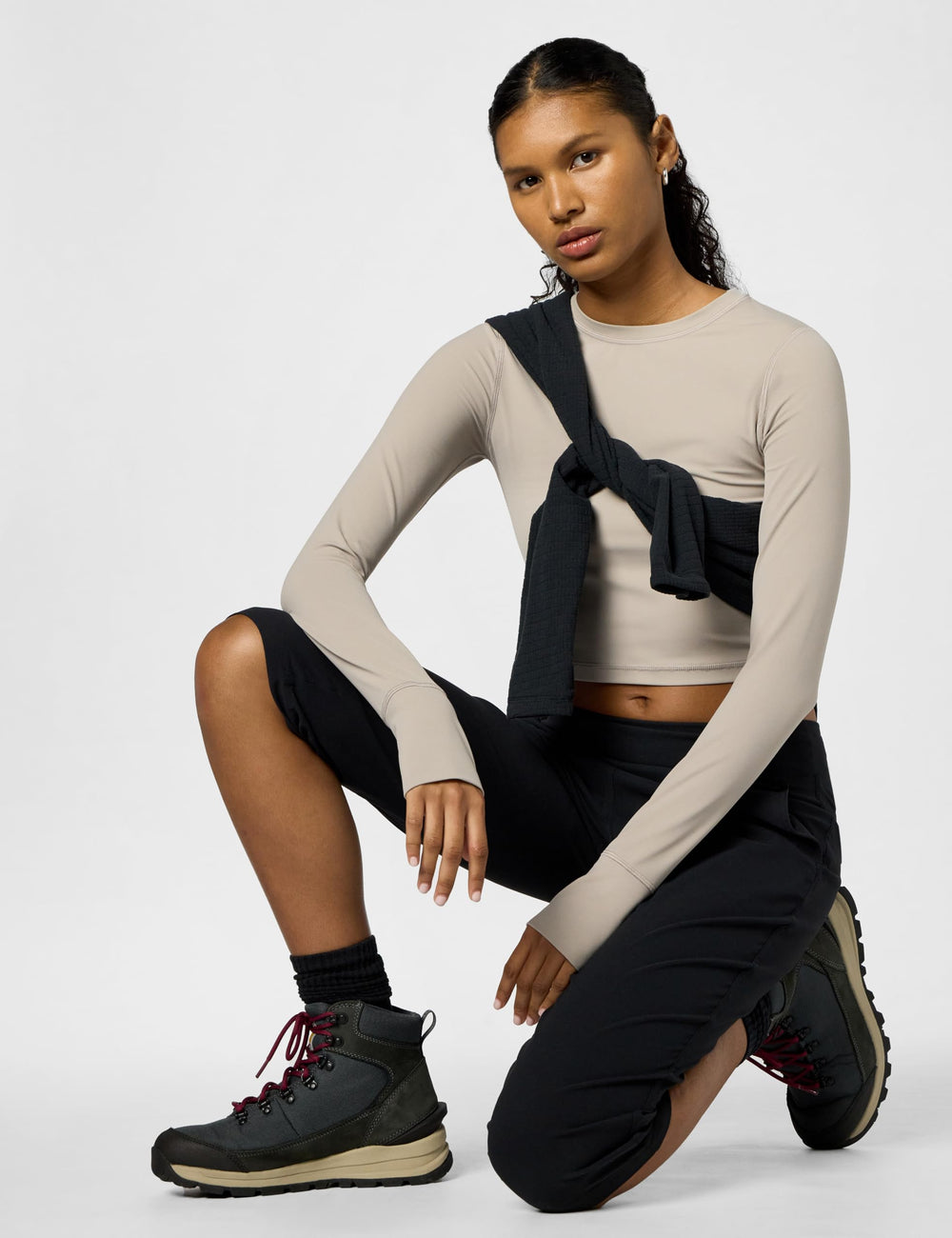 Mountain Hardwear Dynama Capri side view shows secure pocket and streamlined silhouette.