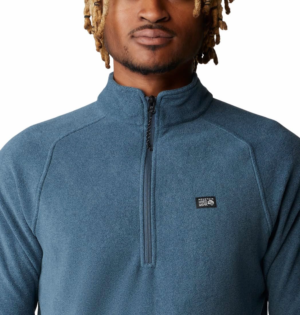Mountain Hardwear MicroChill 1/4 Zip Pullover Montauk Blue Heather emblem closeup shows rugged styling and logo detail.
