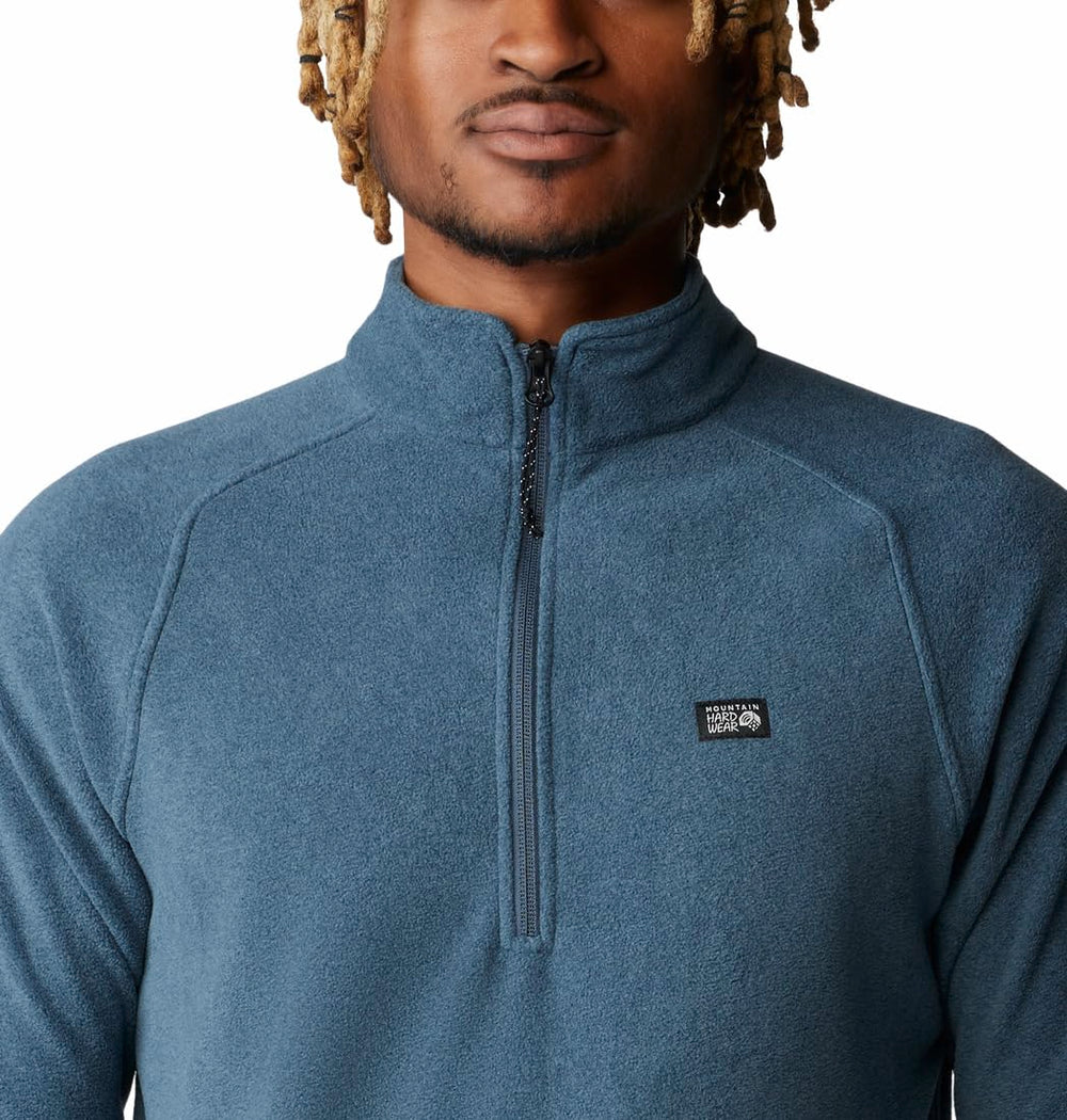 Mountain Hardwear MicroChill 1/4 Zip Pullover Montauk Blue Heather emblem closeup shows rugged styling and logo detail.