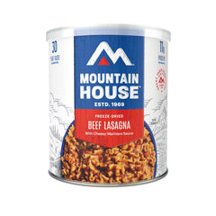 Mountain House beef lasagna pouch ready to serve on camping stove, a comforting trail dinner.