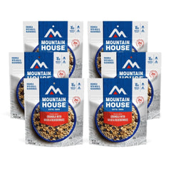 Mountain House granola with milk and blueberries pouch-prepare demonstrates quick trail-ready meal.