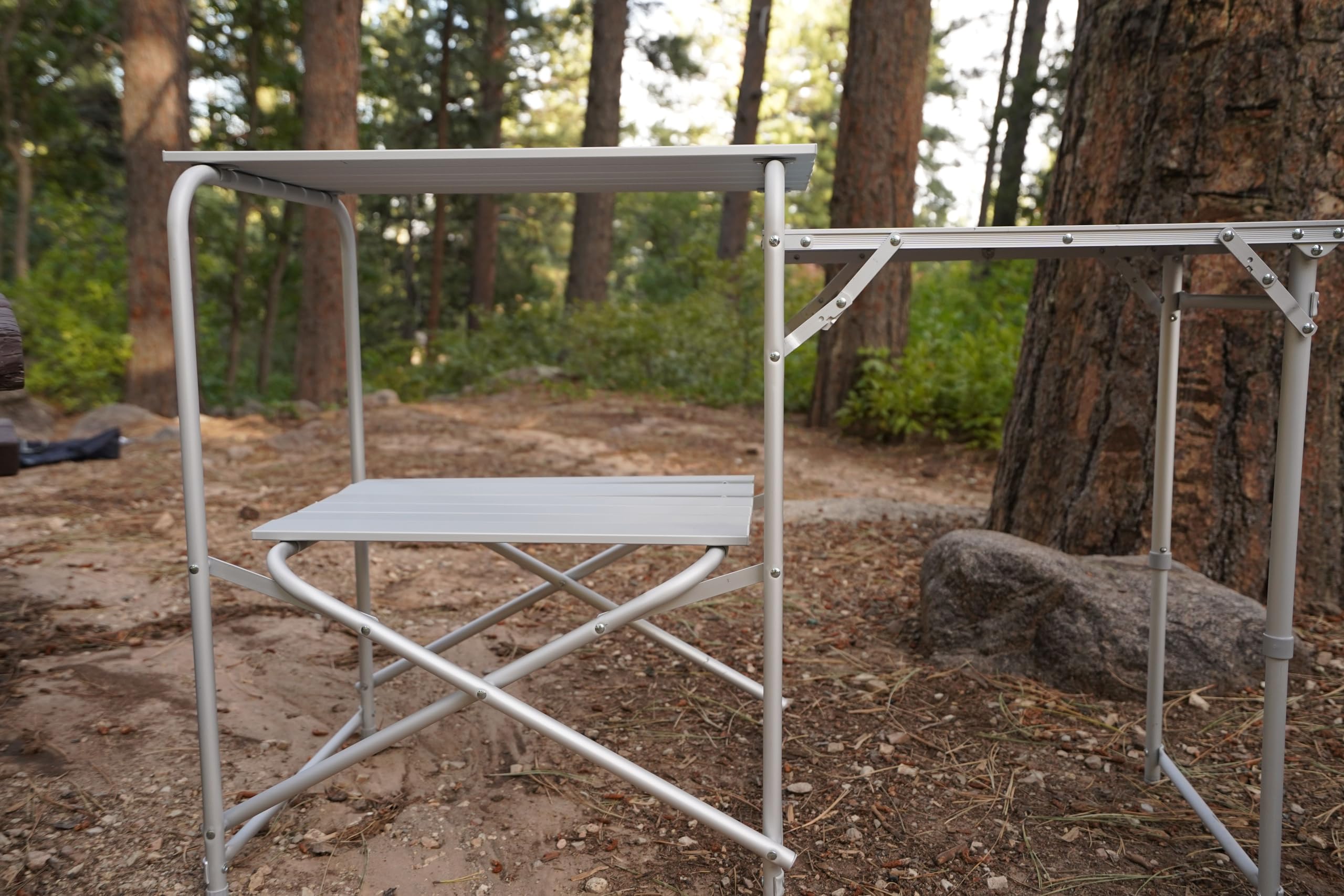 Mountain Summit Gear roll-top kitchen with adjustable legs ensures stable cooking on uneven ground.