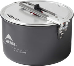 MSR aluminum strainer lid in action for draining and serving camp meals.