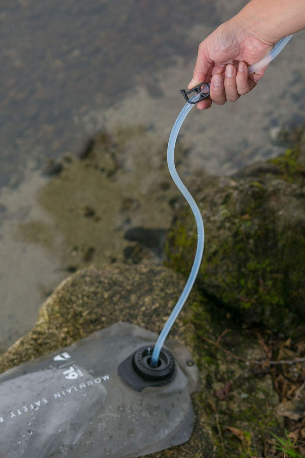 MSR AutoFlow XL includes hanging strap and pocket clip for mobility.